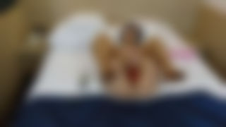 Dildoed and stockinged in the hotel room